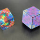 Conundrum House - Kaleidoscope pattern inside out and Color Burst cube. Two of the over 70 shapes that the Unfolding Magnetic Magic Cube can be shaped into.